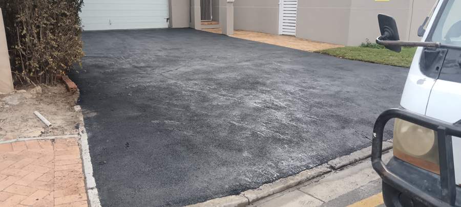 Completed freshly tarred residential driveway