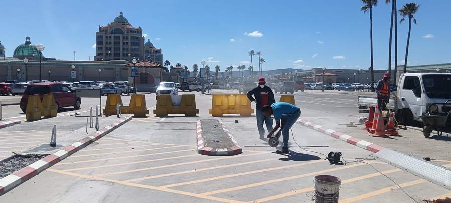 Team cutting and preparing a commercial parking surface