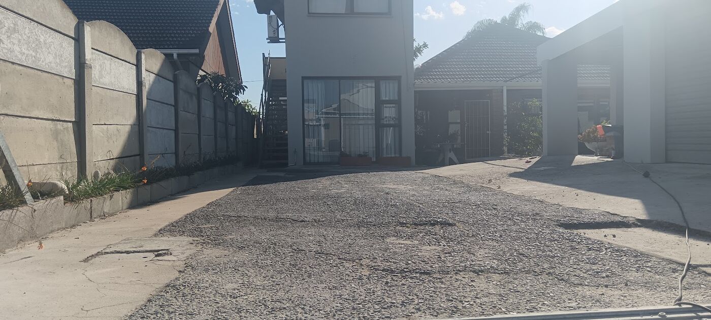 Levelled driveway base ready for asphalt at a Cape Town home