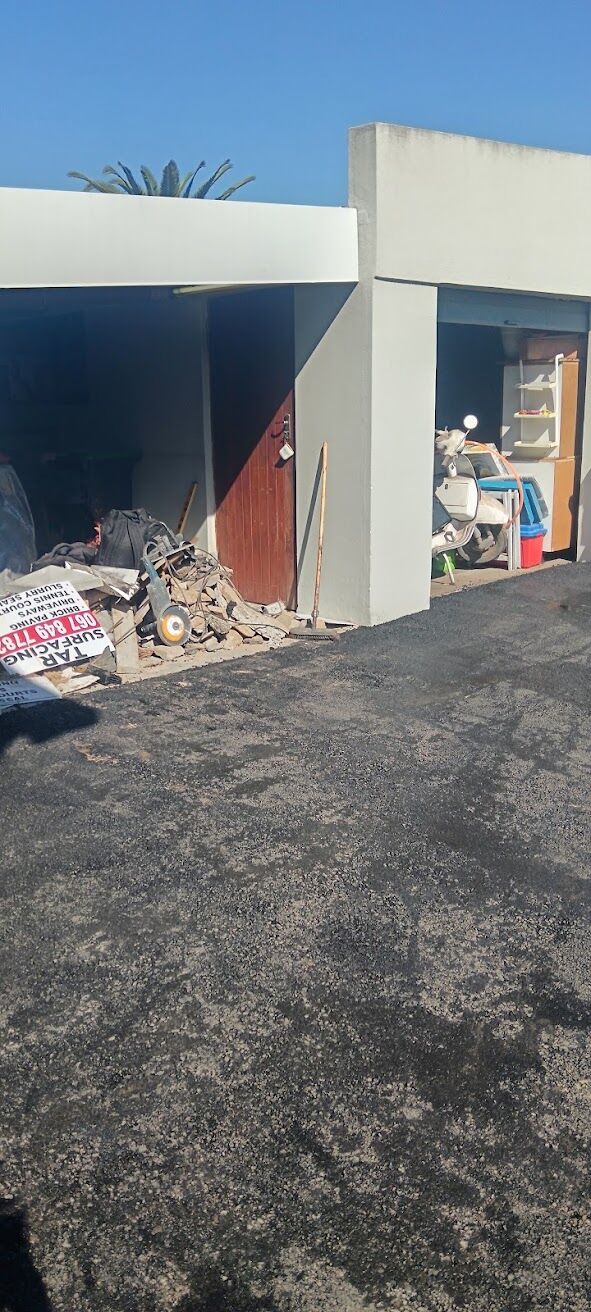 Completed tar driveway at a carport