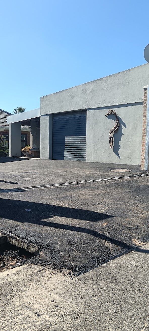 Clean edge where new tar meets existing surface