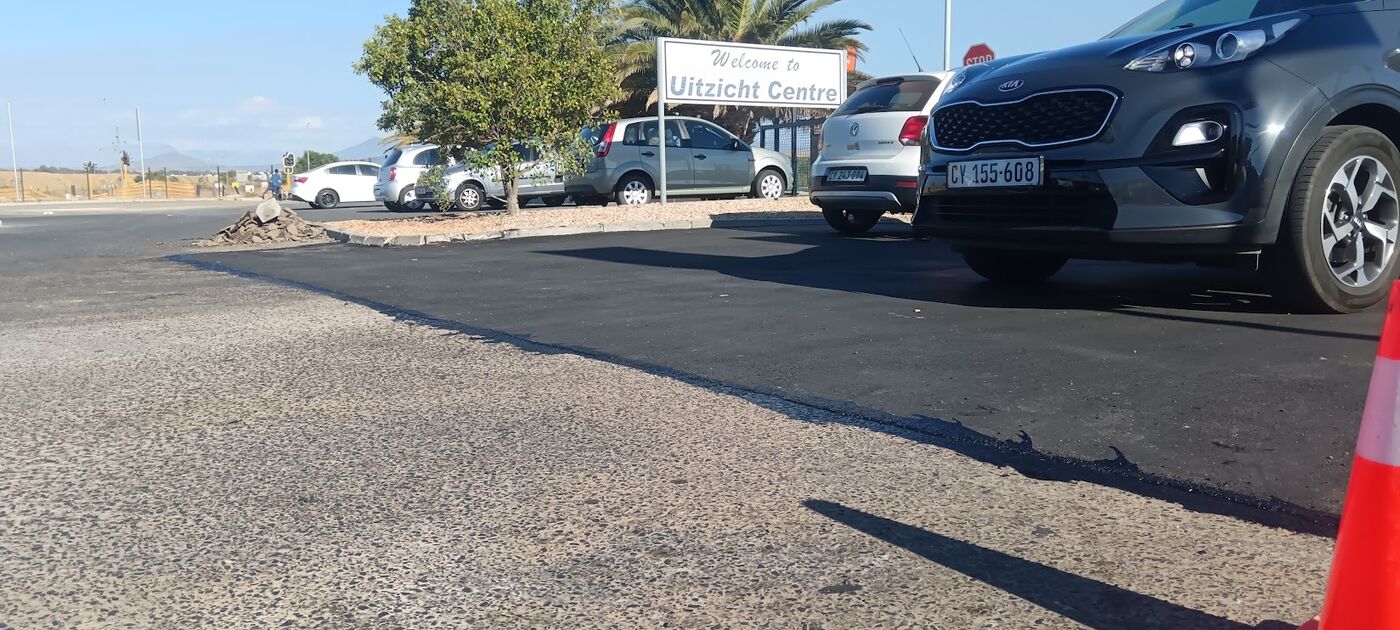 Fresh tar repair at a commercial centre entrance