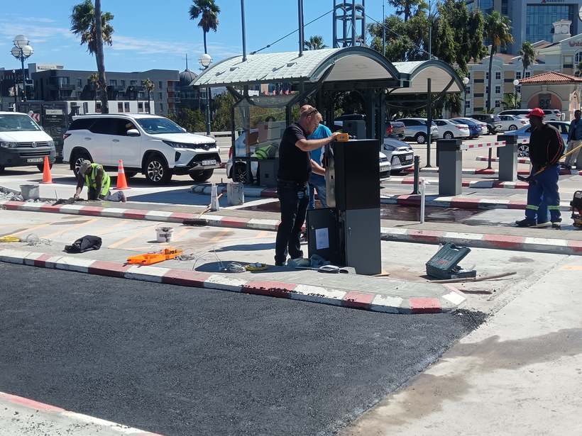 Fresh black asphalt laid at the same Century City gatehouse