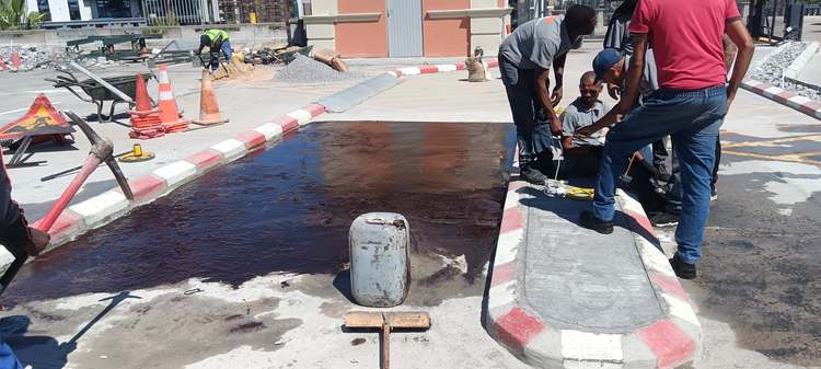 Tack coat applied to prepared surface before asphalt